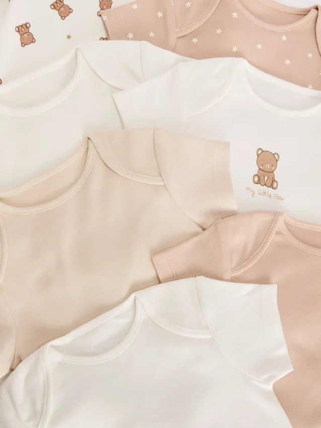 0–36 måneder | 7-pak kortærmede bodysuits