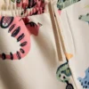 1,5–8 år | Sæt med sweatshirt og sweatbukser med dinosaur-motiv