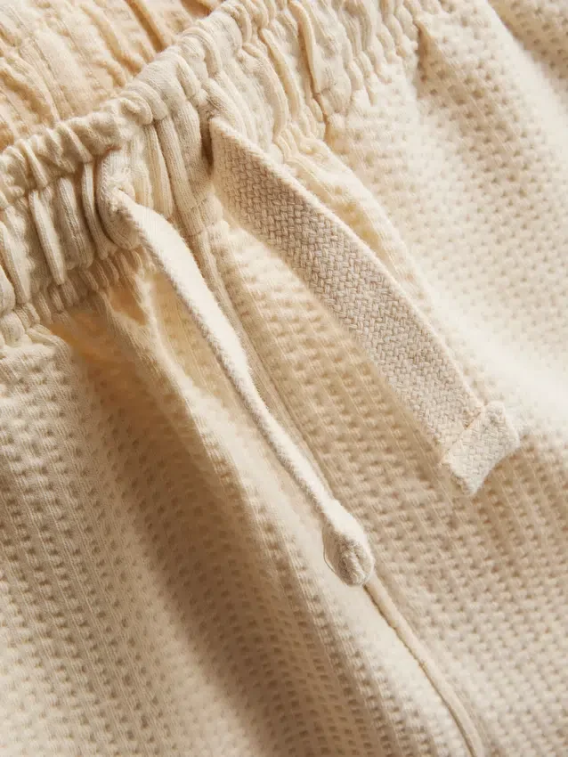 1-9 år | sæt bestående af en struktureret poloshirt og shorts