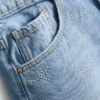 7–15 år | denimshorts med strass-sløjfe