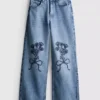 7–15 år | Jeans med brede ben og broderet blomsterbue
