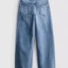 7–15 år | Jeans med brede ben og broderet blomsterbue