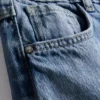 7–15 år | Jeans med brede ben og broderet blomsterbue