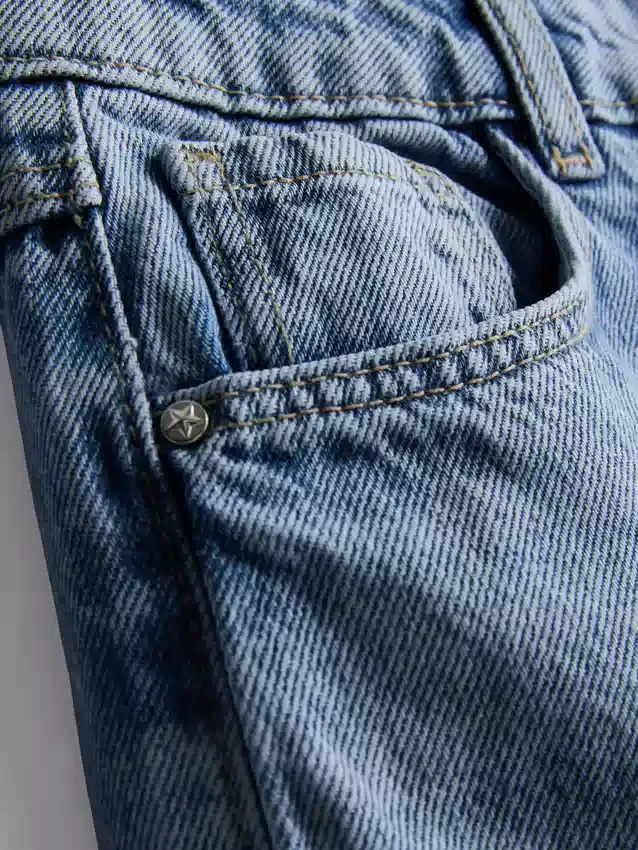 7–15 år | Jeans med brede ben og broderet blomsterbue