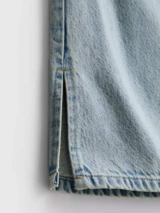 7–15 år | Jeans med slids i sømmen og brede ben