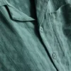 7-15 år | sæt bestående af kortærmet skjorte med knapper og shorts i strukturvævet stof