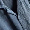 7-15 år | sæt bestående af kortærmet skjorte med knapper og shorts i strukturvævet stof