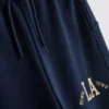 7–15 år | Sæt bestående af T-shirt og joggingbukser med brede ben