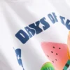 7–15 år | T-shirt med frugtmotiv og struktur