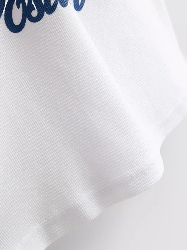 7–15 år | T-shirt med frugtmotiv og struktur