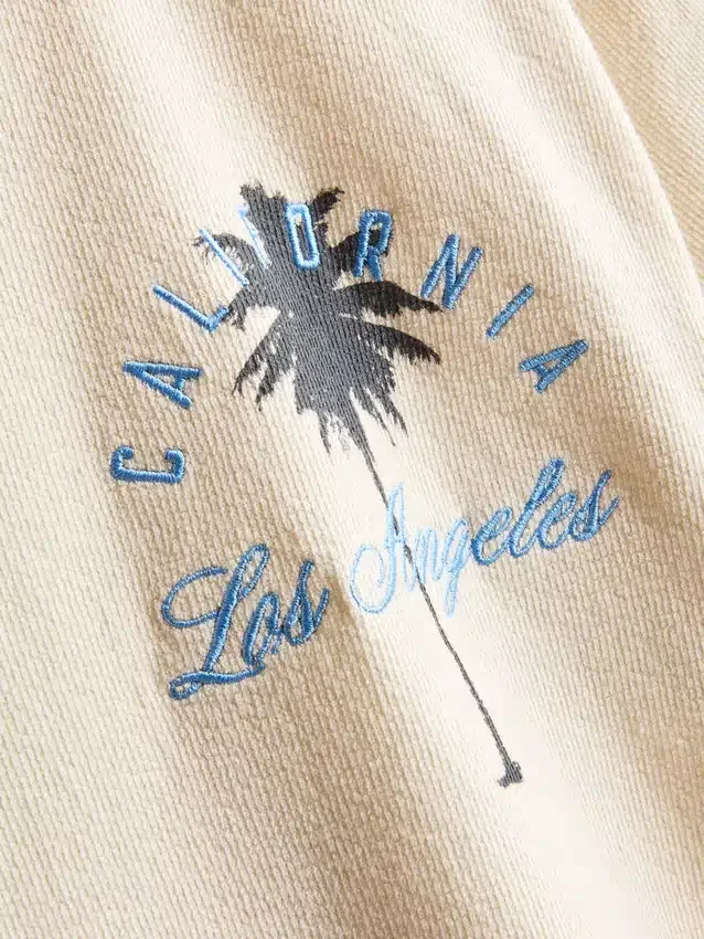 7–15 år | T-shirt med palme-print og struktur