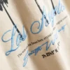 7–15 år | T-shirt med palme-print og struktur