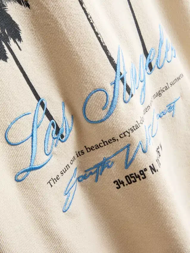7–15 år | T-shirt med palme-print og struktur