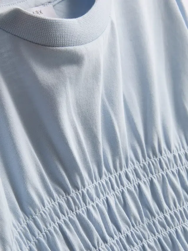7-15 år | T-shirt med rynket peplum