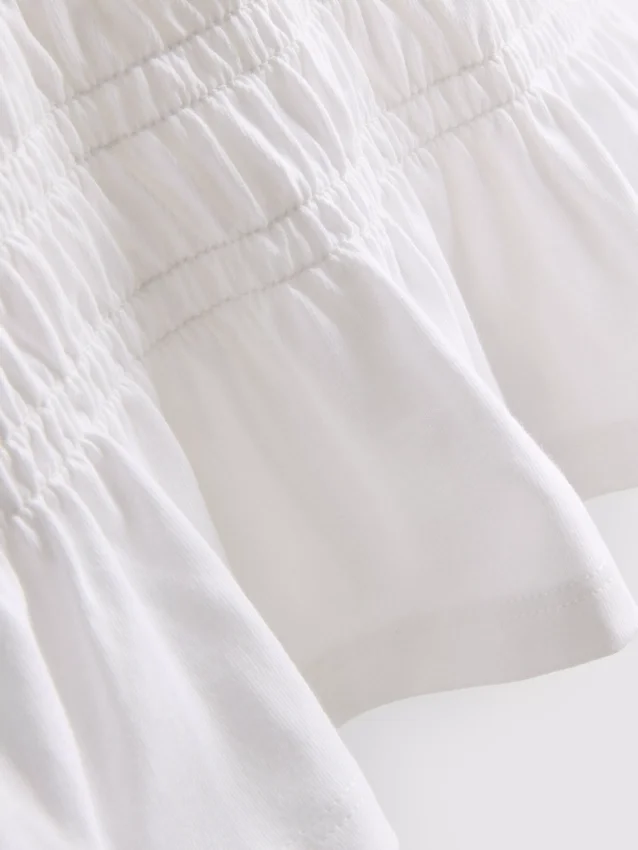7-15 år | T-shirt med rynket peplum
