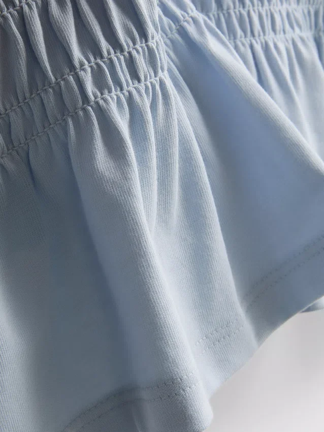 7-15 år | T-shirt med rynket peplum
