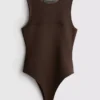 Ærmeløs bodysuit med mesh-indsats