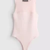 Ærmeløs bodysuit med mesh-indsats
