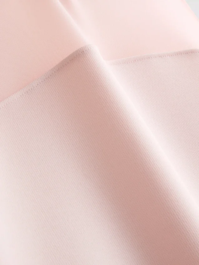 Ærmeløs bodysuit med mesh-indsats