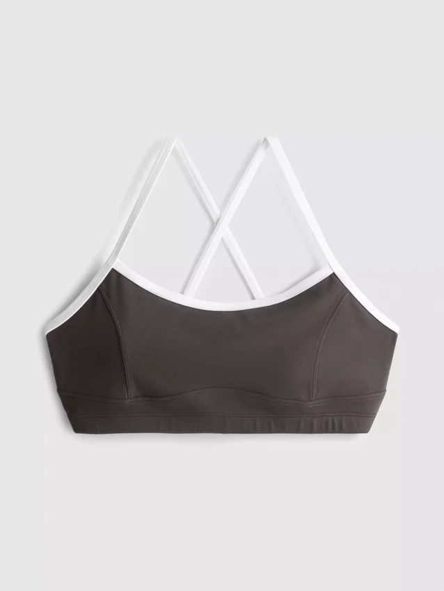 Aktiv crop-top med kontrastkant og krydsryg