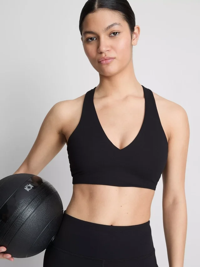 Aktiv crop-top med V-udskæring og glat pasform