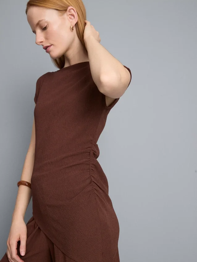 Asymmetrisk krøllet top