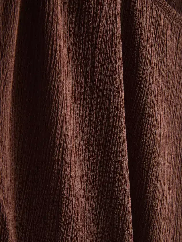 Asymmetrisk krøllet top