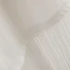 Asymmetrisk T-shirt i bomuld med frynser