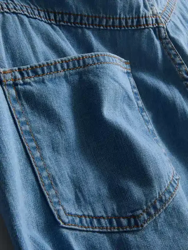 Asymmetrisk wrap-skort i bomuldsdenim