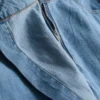 Asymmetrisk wrap-skort i bomuldsdenim