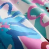 Badeshorts med blomster-graffiti-mønster