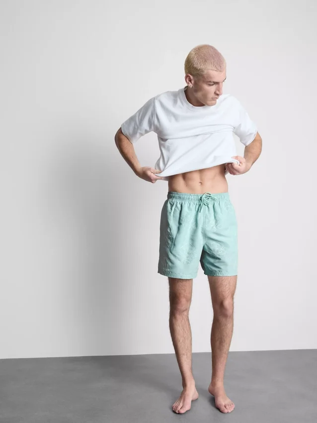 Badeshorts med broderede blade