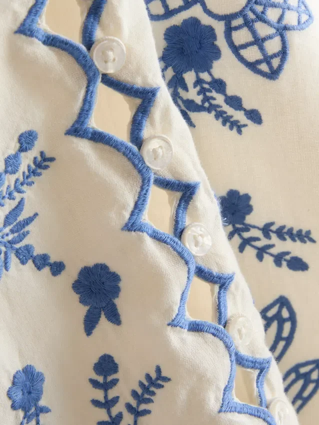 Bluse i bomuld med blomsterbroderi