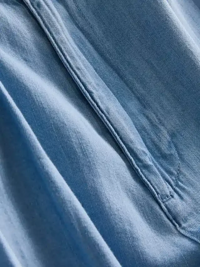 Bredbenede jeans i plisseret bomuldsdenim