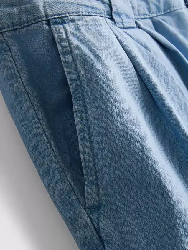 Bredbenede jeans i plisseret bomuldsdenim