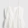 Cami-top i bomuld med broderet peplum-kant