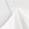 Cami-top i bomuld med broderet peplum-kant