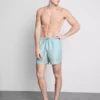 Geometriske svømmeshorts med vifteformet mønster