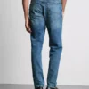 Jeans med mellemhøj talje og slim fit