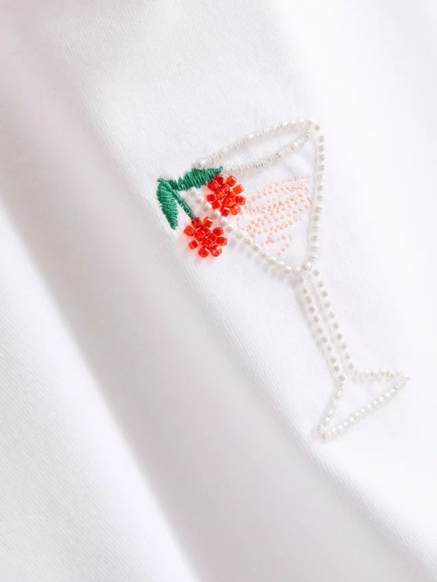 Kort baby-T-shirt med perler, med højt bomuldsindhold