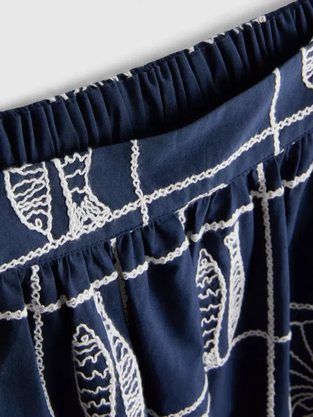 Midi-nederdel i bomuld med broderi i A-silhuet