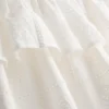 Mini-nederdel i bomuld med lag-på-lag-design og broderi