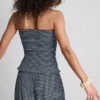Paula Echevarría bandeau-top i gingham med flæser