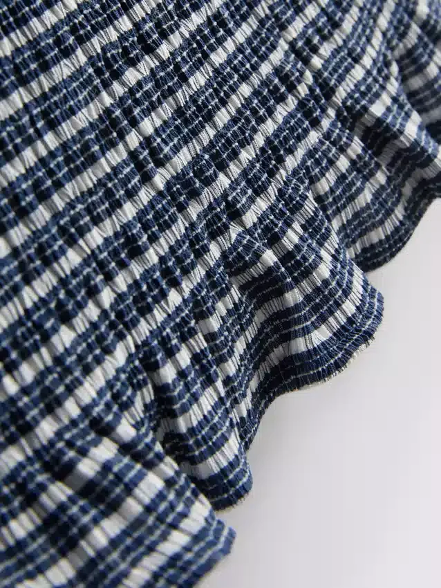 Paula Echevarría bandeau-top i gingham med flæser