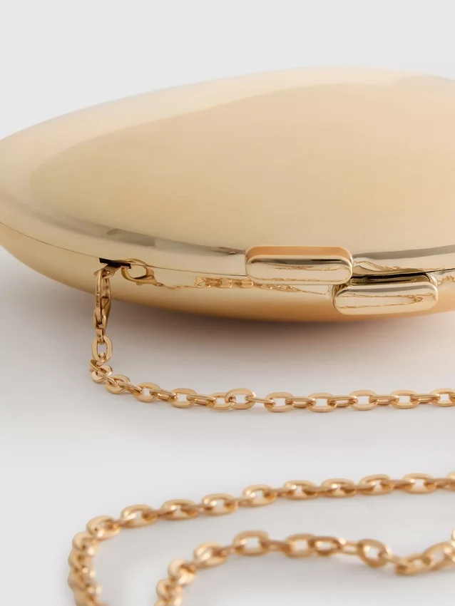 Paula Echevarría metallisk oval skuldertaske