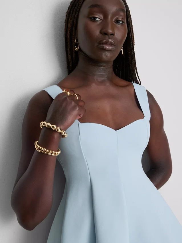 Peplum-top i crepe med hjerteudskæring