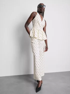 Peplum-top med halterneck og prikker