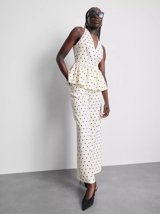 Peplum-top med halterneck og prikker