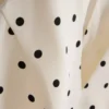 Peplum-top med halterneck og prikker
