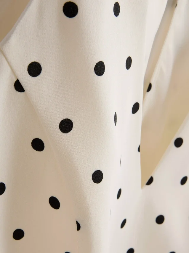 Peplum-top med halterneck og prikker